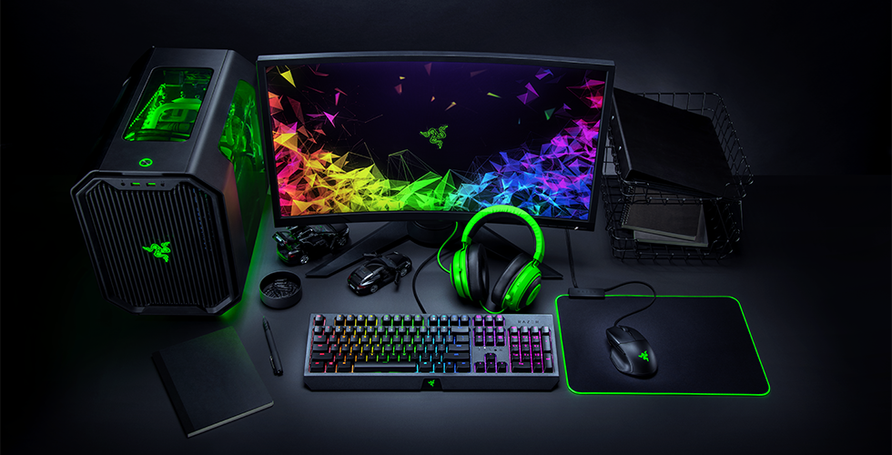 A complete gaming battlestation with all peripherals and room lights synchronized with Razer Chroma RGB for an immersive experience.